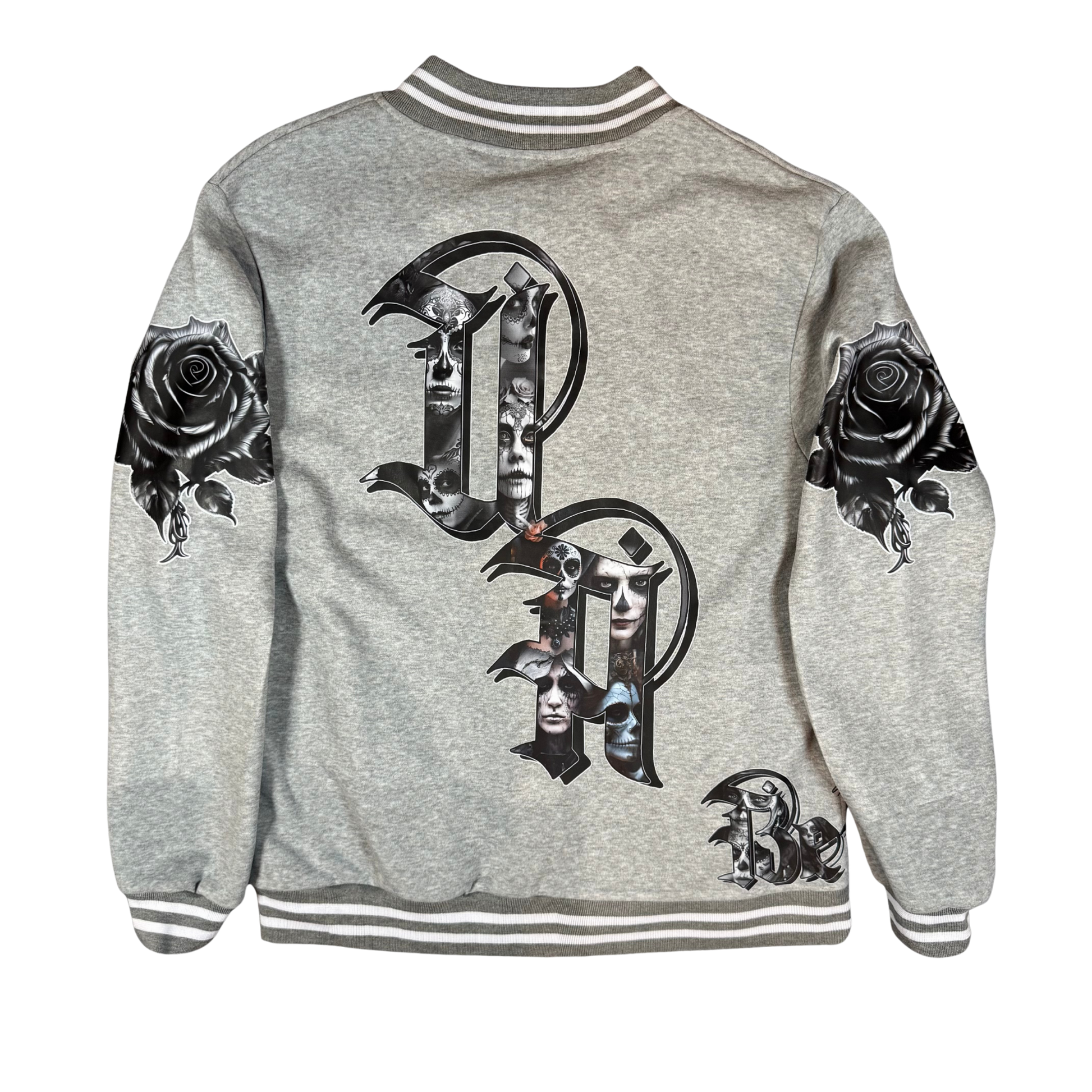 Back view of grey bomber jacket featuring oversized gothic UA letters filled with Day of the Dead artwork and black rose graphics on each sleeve.