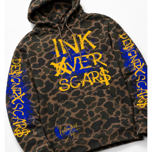 A leopard-print hoodie with yellow and blue graphic text on the front and sleeves, featuring a kangaroo pocket and drawstring hood, photographed on a light gray background.